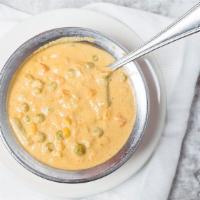 Navrattan Korma · Mixed vegetable cooked with nuts in a mild creamy sauce.