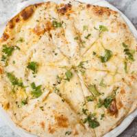 Naan (Onion /Garlic /Bullet) · White flour leavened bread with your choice of topping.