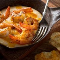 Fried Shrimp With Grits · Appetizing seafood dish prepared with Fried Shrimp, served over a house special portion of g...