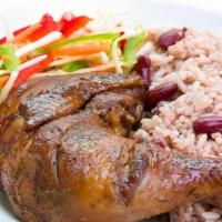 Organic Jerk Chicken · Marinated in fresh Jamaican spices grilled with fresh Jamaican sauce. served wit rice and pe...