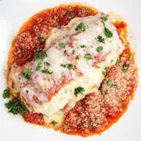 Lasagna · Our dinner portion of lasagna is so big, it's often enough for lunch the next day! Layers of...