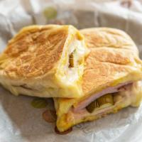 Regular Cuban Sandwich · Mojo pork loin, ham, Swiss, pickles, yellow mustard on Cuban bread. swap pepper jack and jal...
