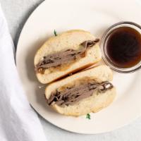 French Dip · Sliced roast beef, Provolone cheese, caramelized onions served with au Jus dip.