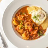 Shrimp & Grits · Sautéed Gulf brown shrimp, bacon, tomatoes, tomato broth, McEwen and Sons grits, red-eye gra...