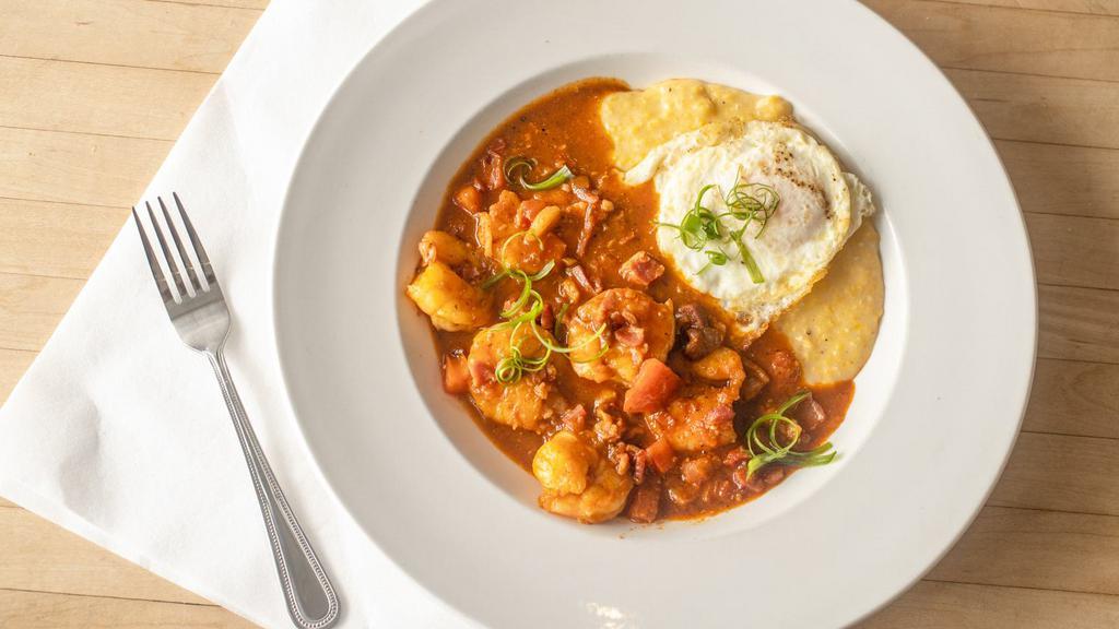Shrimp & Grits · Sautéed Gulf brown shrimp, bacon, tomatoes, tomato broth, McEwen and Sons grits, red-eye gravy, and an egg.