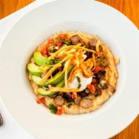 Huevos Rancheros Grits Bowl · McEwen and Sons cheese grits,meat choice, saucy black beans, crispy tortilla strips, cilantr...