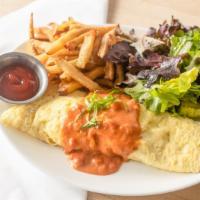 Creole Omelet · Stuffed with shrimp, andouille, onions, tomatoes, and cheddar. Topped with tomato gravy and ...