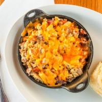 Bbb Skillet · Three scrambled eggs, bacon, sausage, ham, onions, potatoes, and cheddar. Served with your c...
