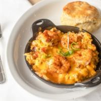 Low Country Skillet · Two eggs, shrimp, andouille sausage, cheddar, onions, peppers, tomatoes, and potatoes. Serve...