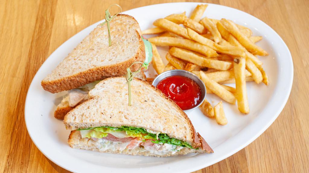 Lunch Counter Chicken Salad Sandwich · Chef's grandmother's white-meat chicken salad on toasted wheat or white bread. Dressed with lettuce and tomato. Served with your choice of side.