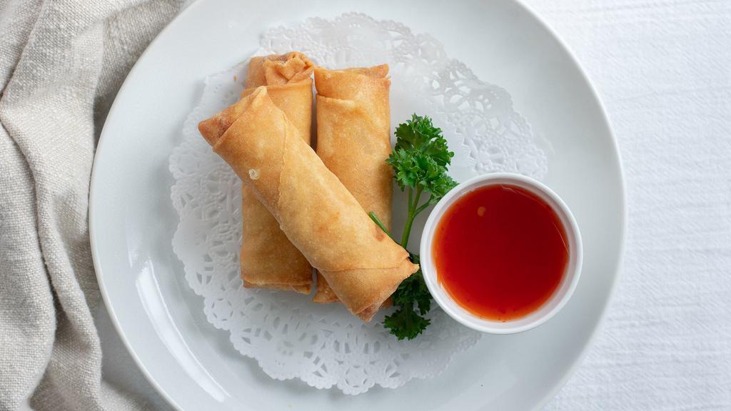 Spring Roll · glass noodle, cabbage, carrot, celery, cilantro wrapped and fried. Served with sweet and sour sauce.