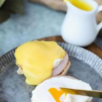 Classic Eggs Benedict · English muffin, Canadian bacon, poached eggs and hollandaise sauce.