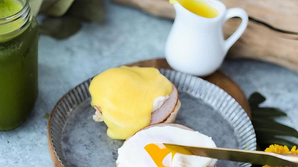 Classic Eggs Benedict · English muffin, Canadian bacon, poached eggs and hollandaise sauce.