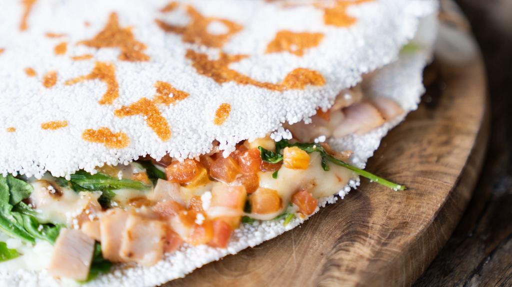 Tapioca Crepe - Build Your Own · Gluten-free Brazilian classic crepe made of tapioca (yucca) starch - Build your own Tapioca - up to 4 *fillings included. Served with two cheese breads.