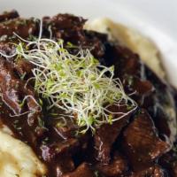 Filet Mignon On Wine Sauce · Our mouth-watering pulled filet mignon slowly-cooked on wine sauce over housemade mashed pot...