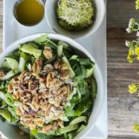 Green Market Salad · Spinach, lettuce, arugula, cucumber, mashed avocado, crunchy nuts and citrus dressing.
