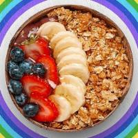 Spirit Guide Acai Bowl · Acai bowl topped with granola, bananas, blueberries, strawberries, and honey.