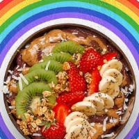 Empowered Acai Bowl · Acai bowl topped with  granola, strawberries, kiwi, banana, shredded coconut, chia seeds, al...