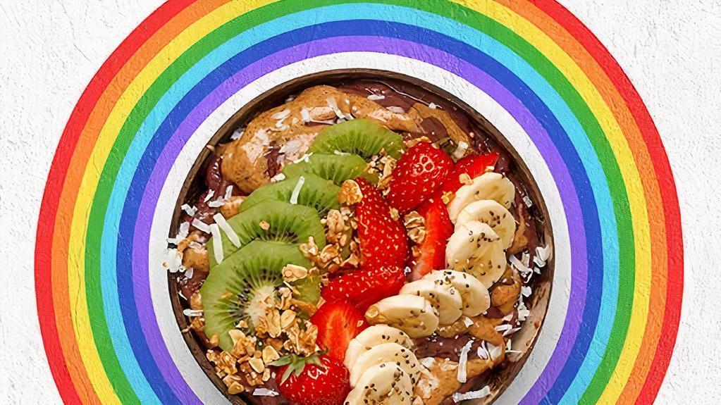 Empowered Acai Bowl · Acai bowl topped with  granola, strawberries, kiwi, banana, shredded coconut, chia seeds, almond butter, and honey.