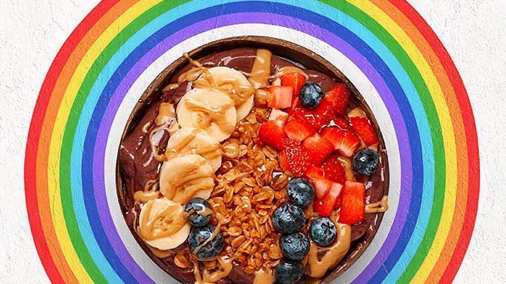 Level Up Acai Bowl · Acai bowl topped with  granola, bananas, strawberries, blueberries, peanut butter, and honey.