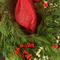 12 In. Whimsical Wreath · This wreath is a perfect combination of fresh cedar, ilex berries and a few sprigs of white ...