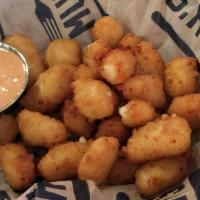 Cheese Curds · Beer battered cheddar cheese curds fried to golden brown, served with our secret comeback sa...