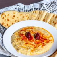 Hummus · Garbanzo bean dip drizzled with olive oil, served with our grilled pita bread and celery.