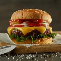 Cheeseburger · Black Angus ground beef burger on a sesame bun topped with cheddar, lettuce, tomatoes, white...