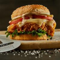 Spicy Crispy Chicken Sandwich · Spicy crispy chicken on a sesame bun topped with cheese, tomato, coleslaw, pickles, and bang...