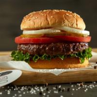 Classic Hamburger · Black Angus ground beef burger on a sesame bun topped with lettuce, tomatoes, white onions, ...