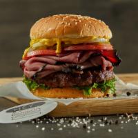 Pastrami Burger · Black Angus ground beef burger on a sesame bun topped with pastrami, white onions, pickles, ...