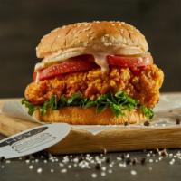 Crispy Chicken Sandwich · Crispy chicken on a sesame bun topped with tomato, coleslaw, pickles, and giant sauce.