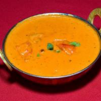 Chicken Tikka Masala · Boneless pieces of chicken marinated and roasted in the tandoor then sauteed in spices and s...