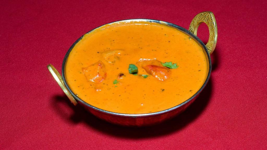 Chicken Tikka Masala · Tender boneless pieces of chicken broiled in the tandoor then cooked in a rich tomato, onion and cream sauce.