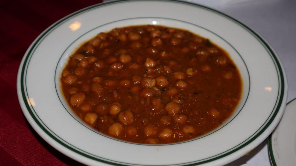 Channa Masala · Chick peas and fresh tomatoes cooked in traditional spices.