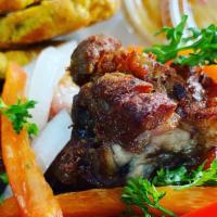 Griot Combo · Haitian seasoned deep fried pork served with plantains, rice and beans