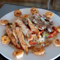 Arroz Mexicano · Plate of rice covered in queso, tomatoes, grilled peppers and onions  topped with grilled ch...