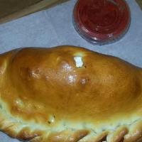 Calzone · Mozzarella, ricotta, parmesan cheese, and one choice of topping with marinara on the side.