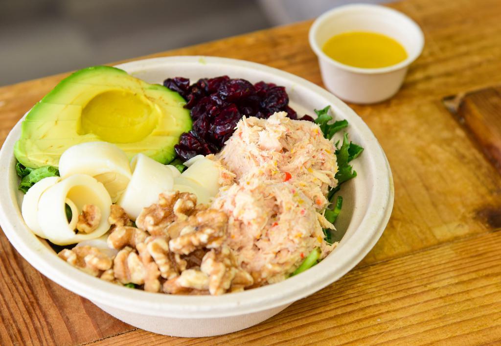 Spring Salad Large · Green mix, tuna mix, the heart of palms, dry cranberries, avocado, walnuts, and honey mustard dressing.