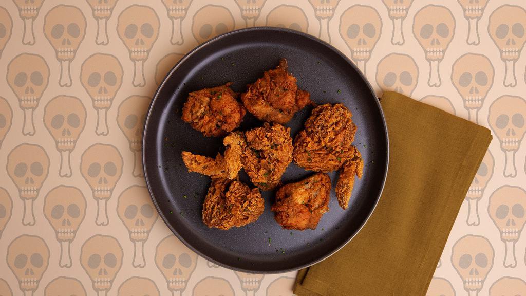 Fried Chicken Wings · Six crispy chicken wings with your choice of dipping sauce.
