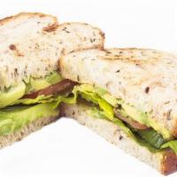 Avocado Toast · A vegetarian's choice. Avocado, sliced tomatoes and lettuce between our multi-grain bread.