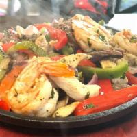 Fajitas Mixta · Fajitas mix - chicken, shrimp, beef. Served with rice & beans or any sides 2 on the sides me...