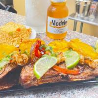 Red Snapper · Fried Red Snapper Served with Rice and Tostones