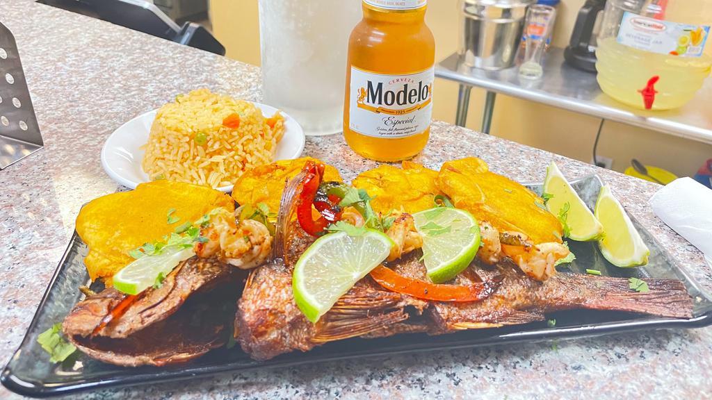 Red Snapper · Fried Red Snapper Served with Rice and Tostones