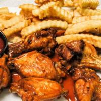 Alitas De Pollo · Chicken wings.  Served with french fries or any side on the menu side.