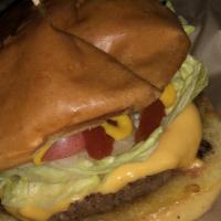 The American · 100% angus beef patty, American cheese, fresh lettuce, tomato, pickles, sweet onions, ketchu...