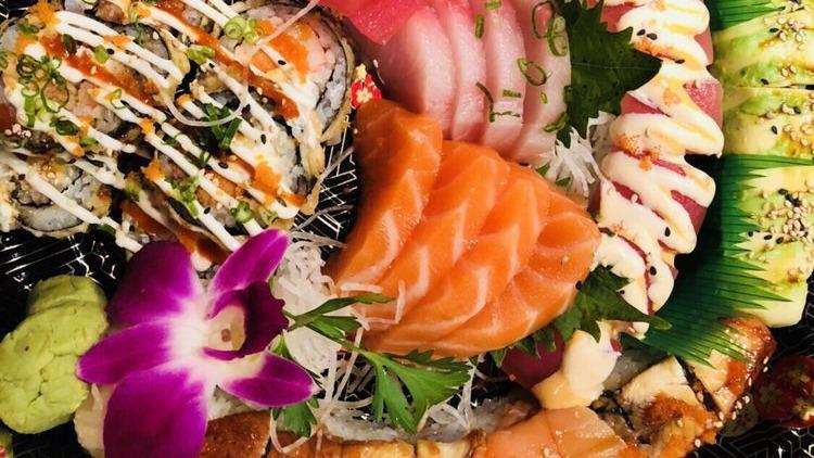 Sashimi & Sushi Combination · Six pieces of sashimi, four pieces of sushi, and one California roll.