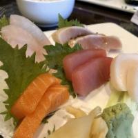 Sashimi Regular · Twelve pieces of assorted raw fish.