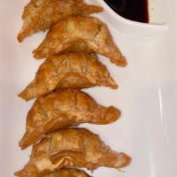 Gyoza · Meat and vegetable dumpling (steamed or fried).