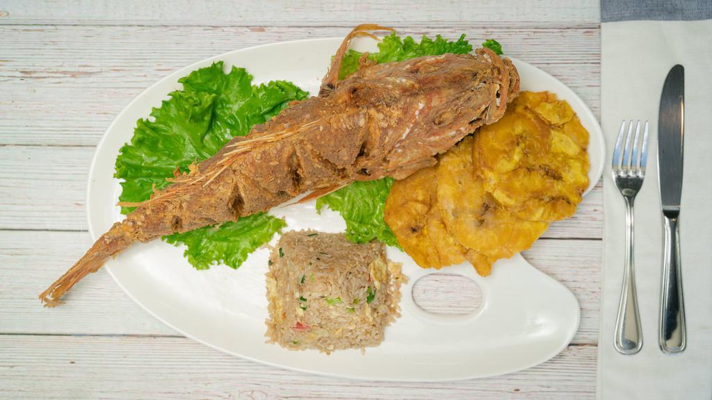 Red Snapper Oriental · Fried whole snapper with sweet, and sour sauce served with fried rice.